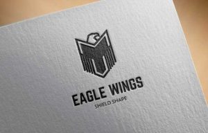 Eagle in shield shape wing logo design icon